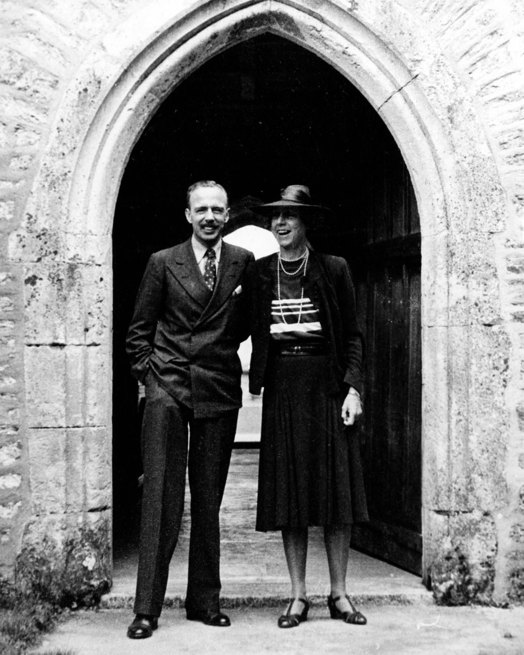 Black and white photograph of Leonard and Dorothy Elmhirst outside the Elmhirst Centre, c1930s
